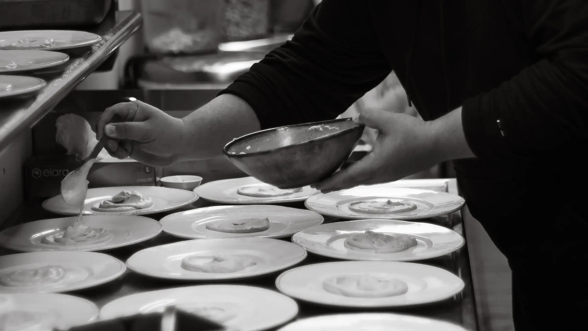 Zay plating desserts during service at Khom Fai
